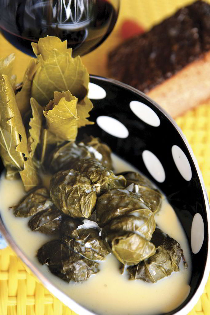 Yiouvarlakia (rice meatballs) in vine leaves and egg and lemon sause